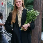 A COMPLETE UNKNOWN ELLE FANNING BLACK COAT
