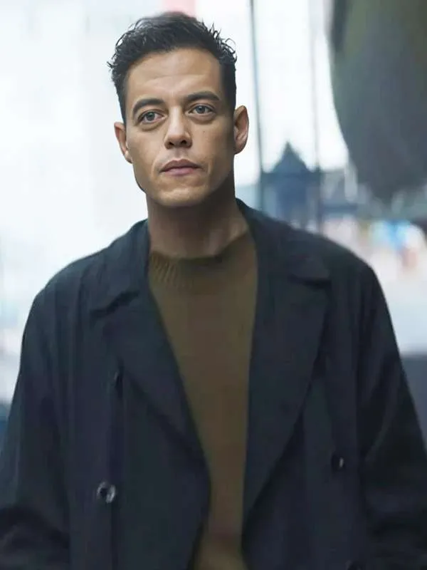183rami-malek-the-amateur-2025-black-trench-coat. Rami Malek The Amateur 2025 Black Trench Coat - Image 1