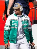 Jalen Hurts wearing the green and white Philadelphia Eagles bomber jacket – front pose