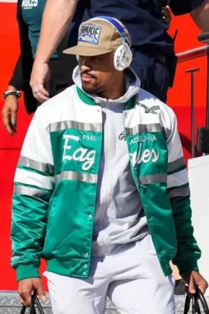 Jalen Hurts wearing the green and white Philadelphia Eagles bomber jacket – front pose