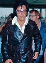 Elvis Presley wearing the Elvis Presley Long Coat at the L.A. Felt Forum.