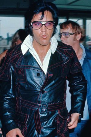 Elvis Presley wearing the Elvis Presley Long Coat at the L.A. Felt Forum.