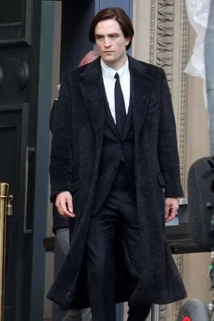 Robert Pattinson wearing The Batman black wool coat in a front zoomed-out view, showcasing the full silhouette and design.