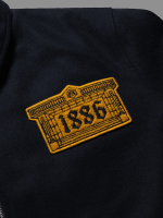 Close-up of Arsenal x Aries Wool Jacket logo of 1886 and fabric texture
