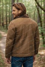 Luke Grimes' camel suede leather jacket has a button closure and two inside and four outside pockets.