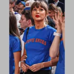 Taylor Swift wearing a Stevie Knicks Blue T-Shirt courtside at Game 4 of the NBA Finals at Madison Square Garden.