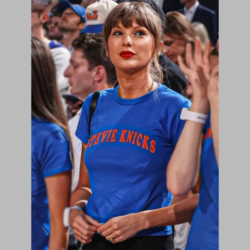Blue-Stevie-Knicks-Taylor-Swift-Finals-Game-4-T-Shirt-510x510 Taylor Swift wearing a Stevie Knicks Blue T-Shirt courtside at Game 4 of the NBA Finals at Madison Square Garden.