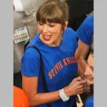 Taylor Swift wearing a Stevie Knicks Blue T-Shirt courtside at Game 4 of the NBA Finals at Madison Square Garden.