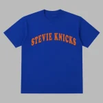 Taylor Swift wearing a Stevie Knicks Blue T-Shirt courtside at Game 4 of the NBA Finals at Madison Square Garden.