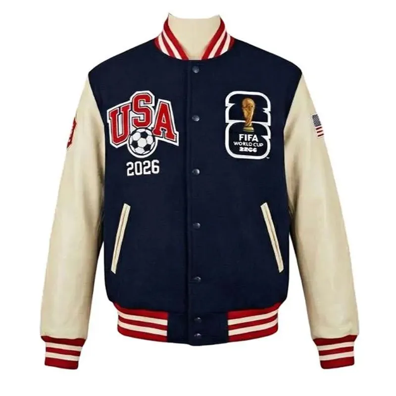 fifa-world-cup-2026-varsity-jacket1 Product Specification: For both genders Inspired by: 2026 FIFA World Cup Material: Wool body with genuine leather sleeves Inner: Viscose lining Color: Navy and Off-White Collar: Rib-knitted Front: Buttoned closure Sleeves: Full with team patches Cuffs and hemline: Rib-knitted Classic 2026 FIFA World Cup spirit detail on front and back Pockets: Two outer pockets and two inner pockets Exclusive stitching: