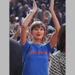 Taylor Swift wearing a Stevie Knicks Blue T-Shirt courtside at Game 4 of the NBA Finals at Madison Square Garden.